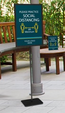 Free standing sign in an outdoor patio that encourages social distancing. stands