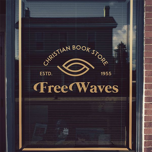 Window with a Graphic On it that Says “Christian Book Store, Est. 1955, Free Waves,” with a Conceptual Wave Icon
