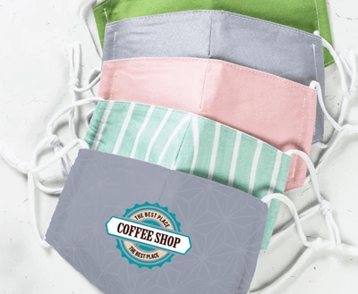 A Stack of Face Masks with the Top One Displaying a Coffee Shop Logo