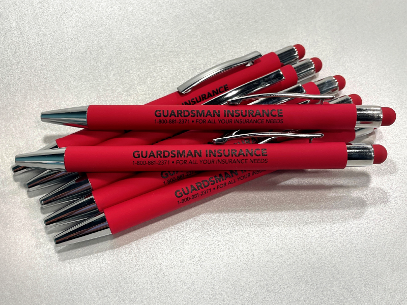 Black logo imprint on a red pen with rubberized barrel and stylus