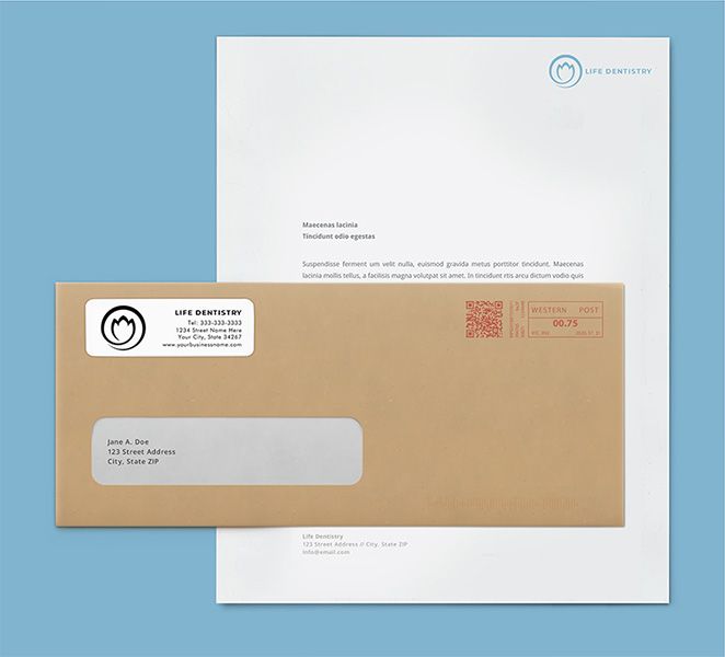 Brown envelope with a custom label in front of a white letter.