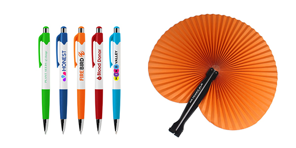 A selection of promotional products including fans and imprinted pens