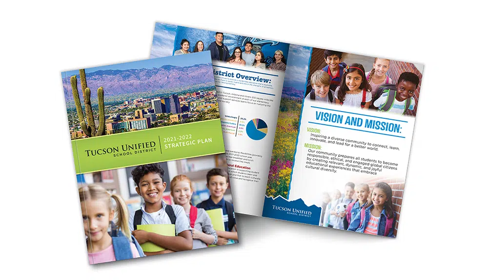 Colorful school district booklet with students on the cover and inside pages showing mission and overview.