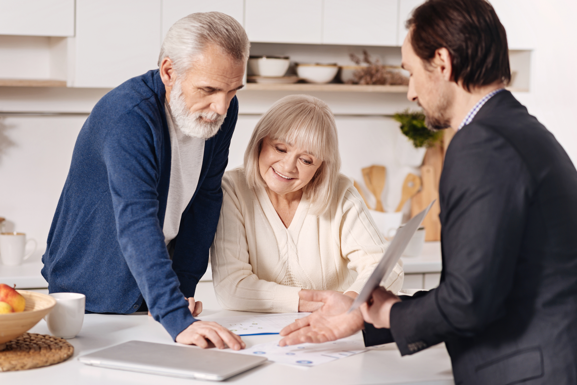 business team working together over a table with documents