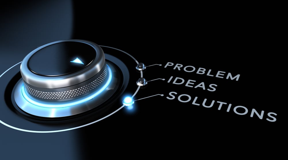 Solution switch positioned on the word solutions over black and blue background. Concept of problem solving.